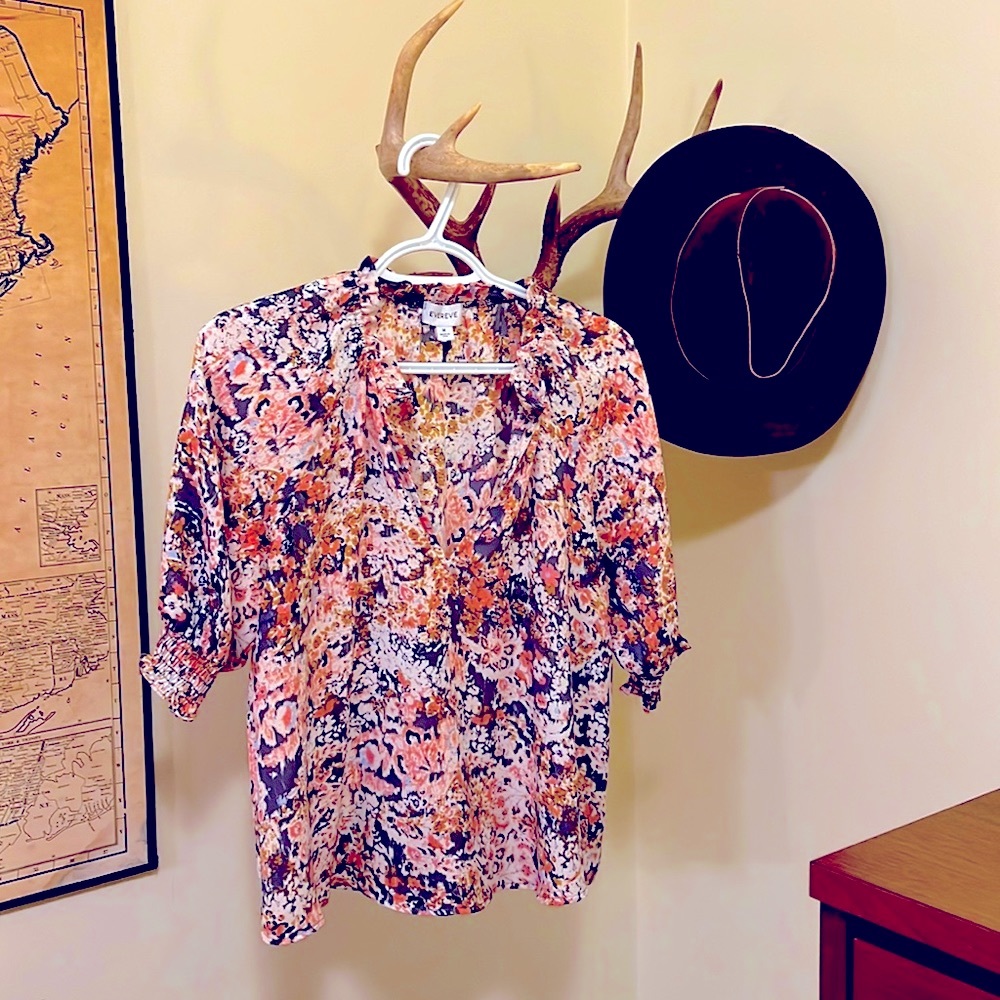 Beautiful Evereve blouse. The back is a couple of inches longer than the front.